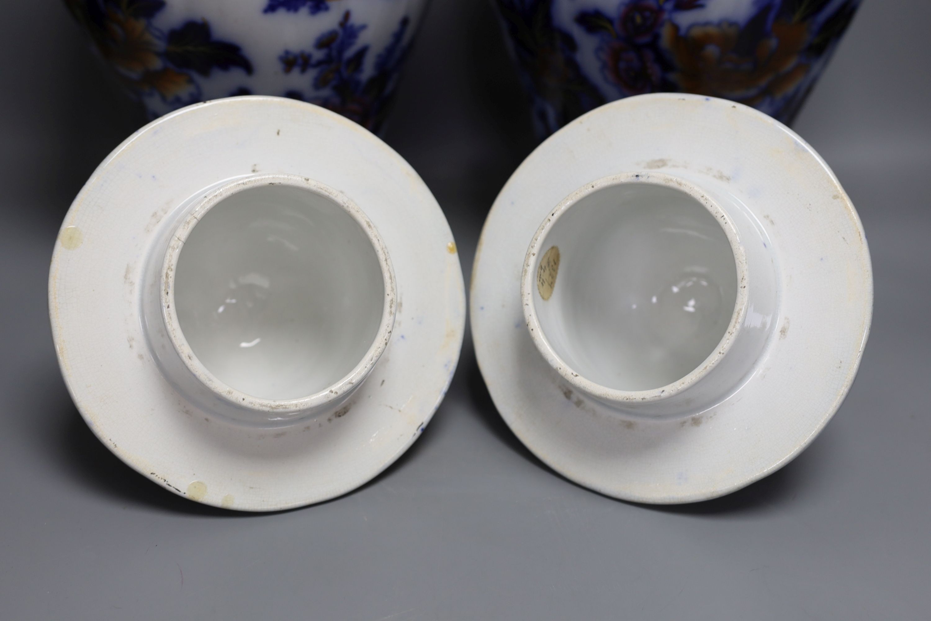 A pair of mid 19th century ironstone vases and covers - 51cm tall